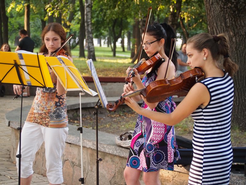 A violin trio performing for tips in the Val park in Chernihiv, Ukraine